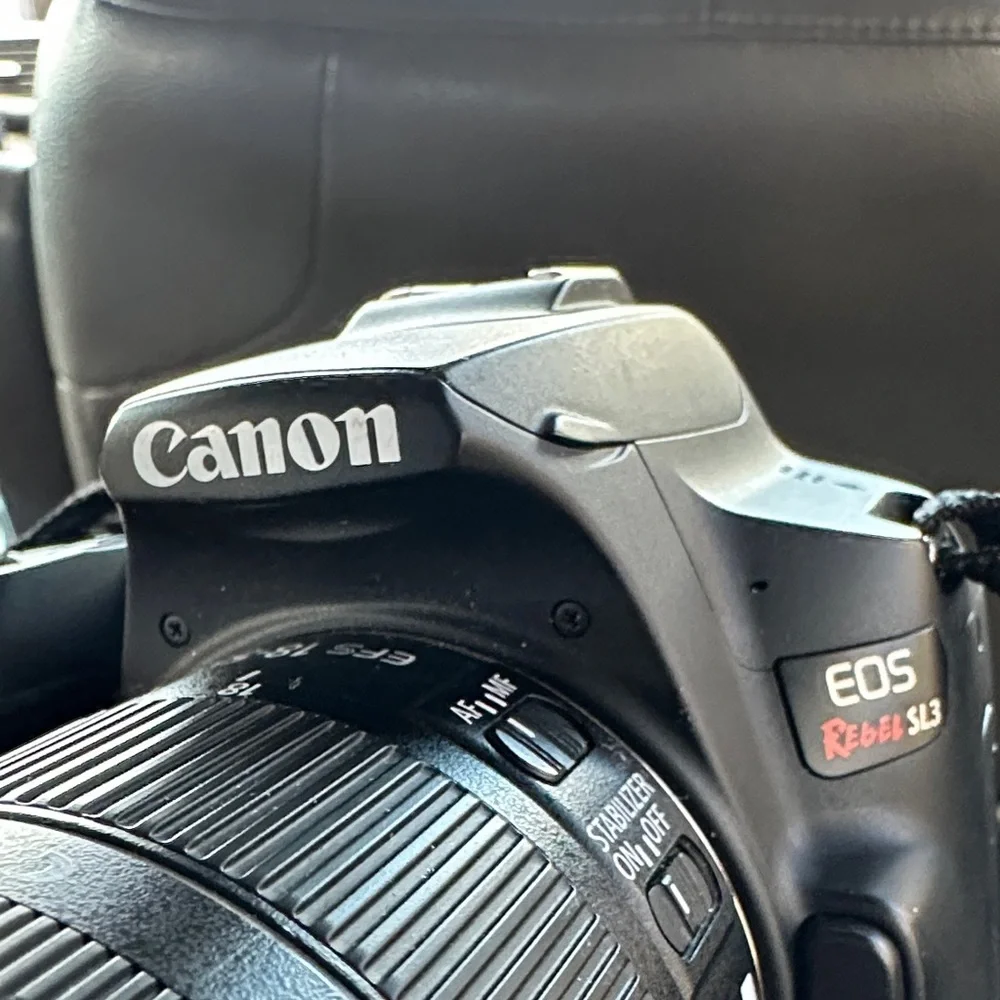 Canon Black DSLR Camera with Lens Cover